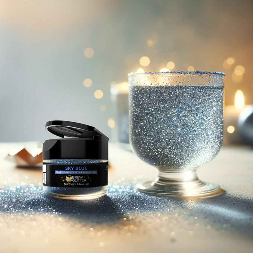 sky blue glitter jar promo shot next to a glass goblet